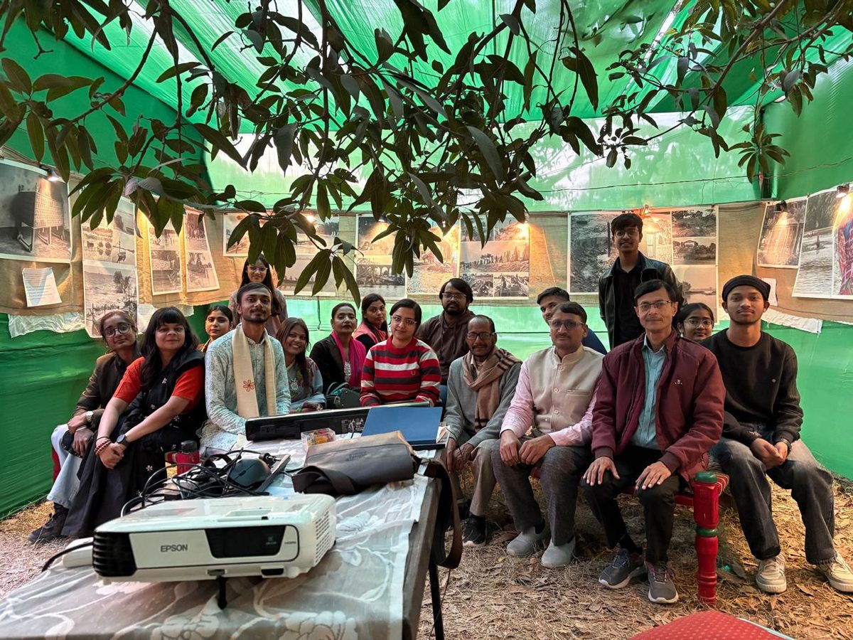 Young people seated around a projector at a Vithi film screening
