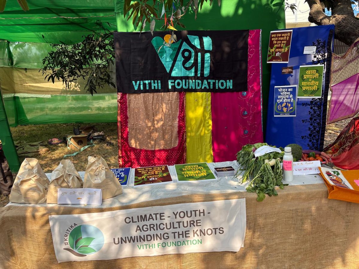 Vithi Foundation stall at Prakritika, with an appliqué banner reading Climate, Youth, Agriculture